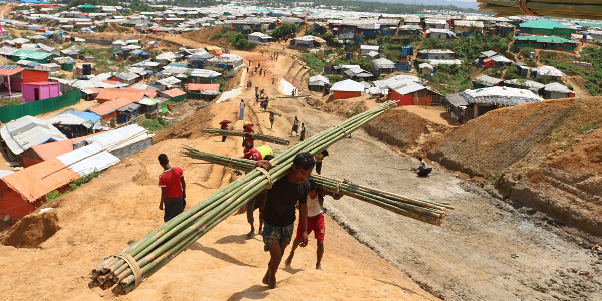 Men carrying building materials